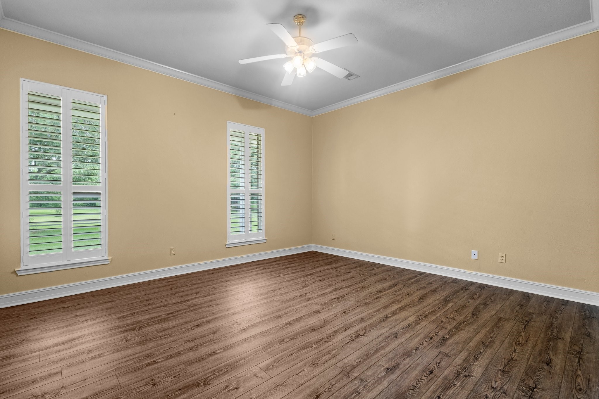 27076 Interstate 10 Winnie, TX 77665 - Photo 17 of 42 a view of an empty room with window and wooden floor