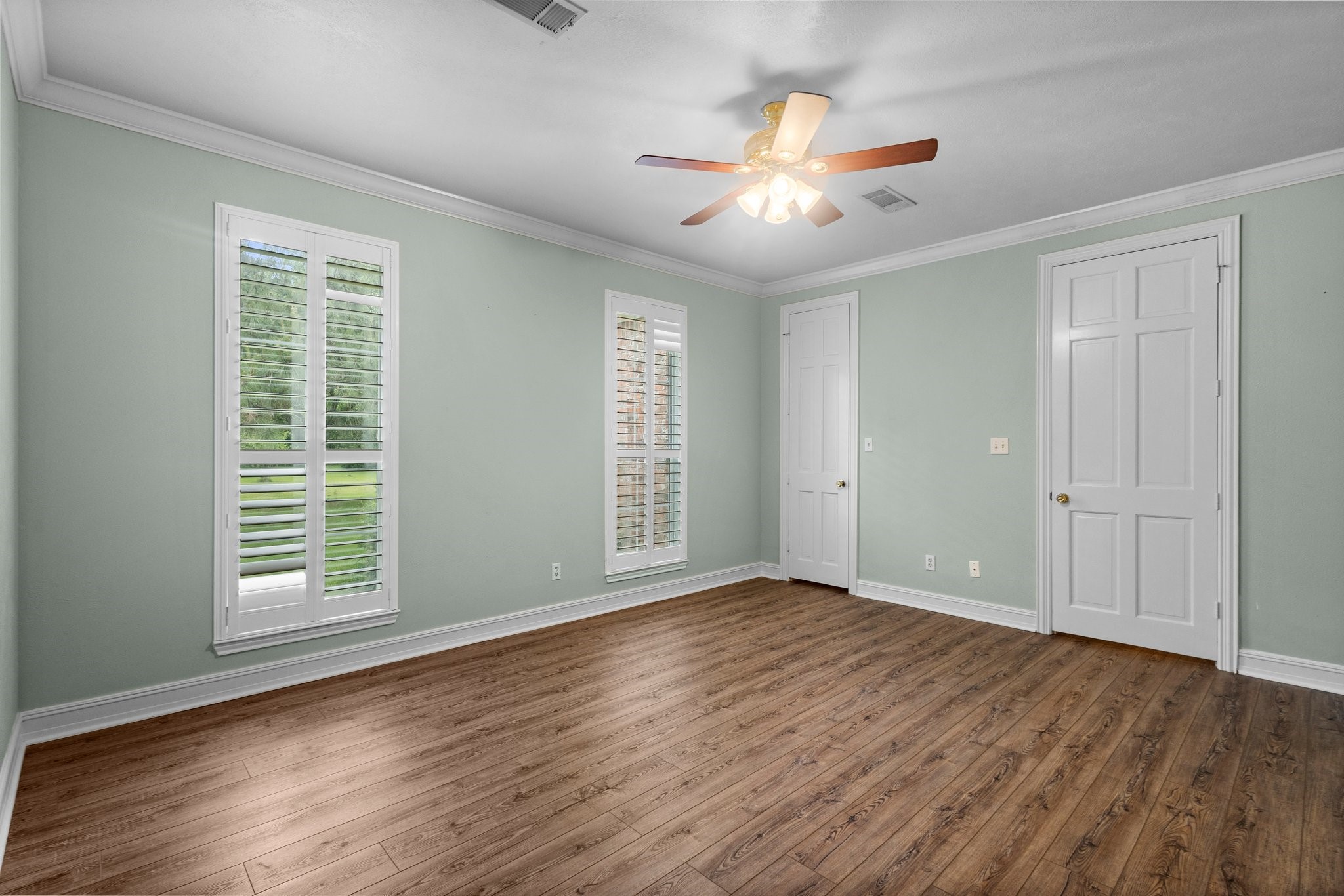 27076 Interstate 10 Winnie, TX 77665 - Photo 19 of 42 a view of an empty room with wooden floor and a window