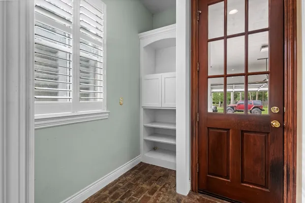 a spacious bathroom with a double vanity sink and a mirror