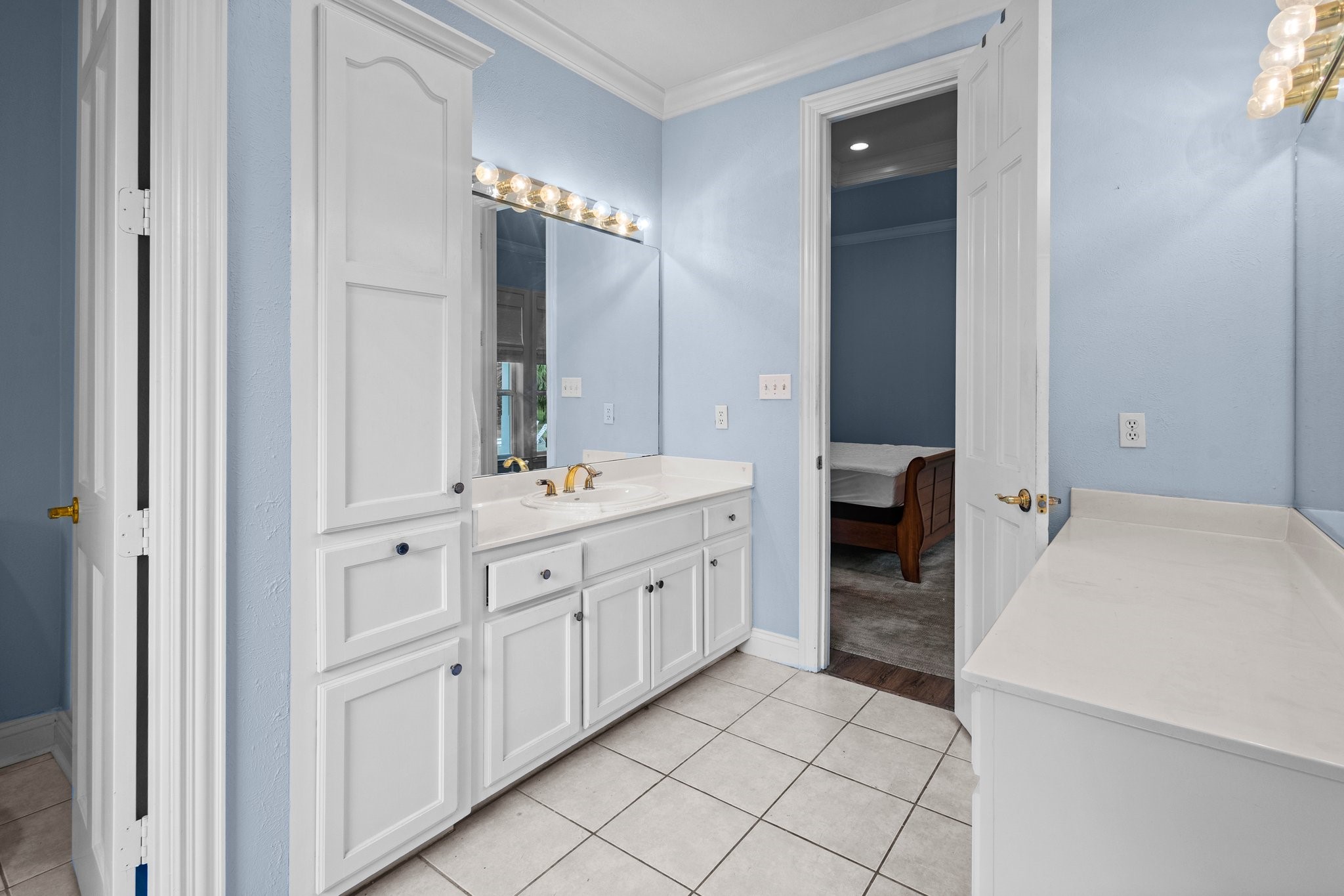 27076 Interstate 10 Winnie, TX 77665 - Photo 21 of 42 a spacious bathroom with a double vanity sink and a mirror