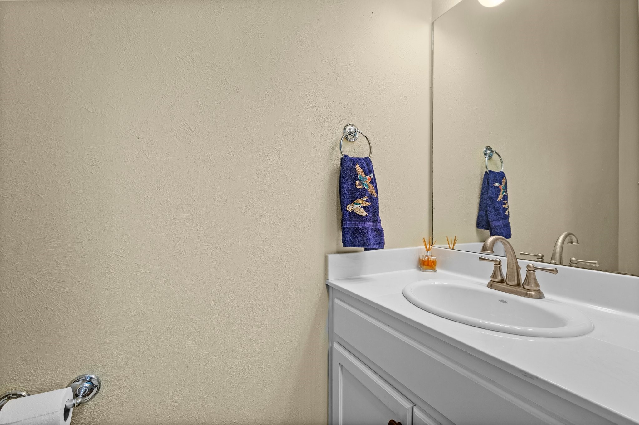 27076 Interstate 10 Winnie, TX 77665 - Photo 23 of 42 a bathroom with a sink and a mirror