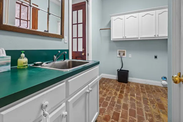 a bathroom with a sink vanity tub and shower