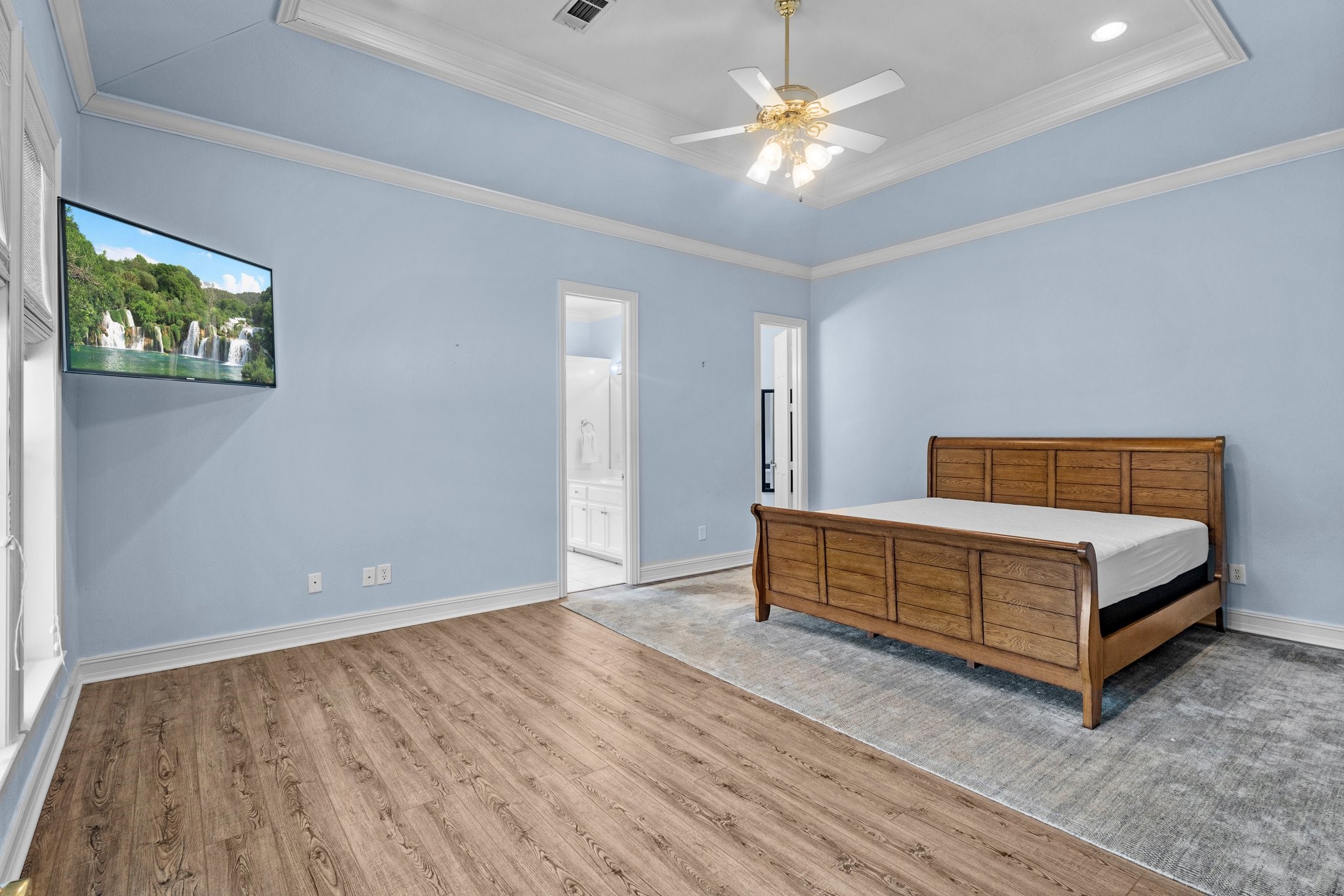 27076 Interstate 10 Winnie, TX 77665 - Photo 26 of 42 wooden floor with a bed and a painting on the wall