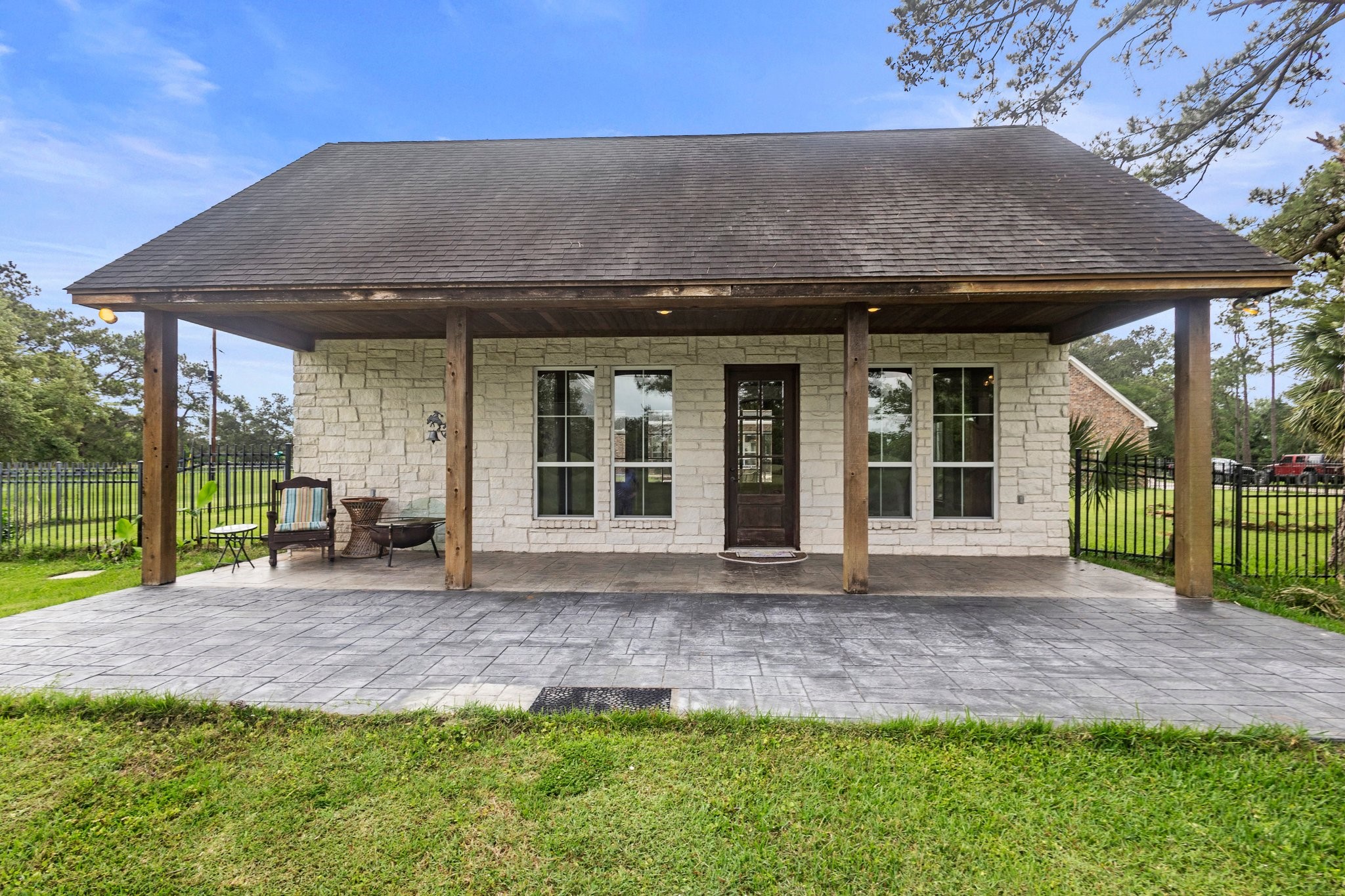 27076 Interstate 10 Winnie, TX 77665 - Photo 29 of 42 a front view of a house with a yard and porch