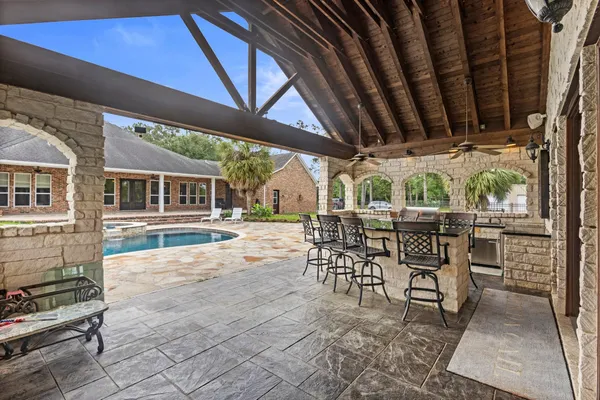 a outdoor dining space with furniture and outdoor view
