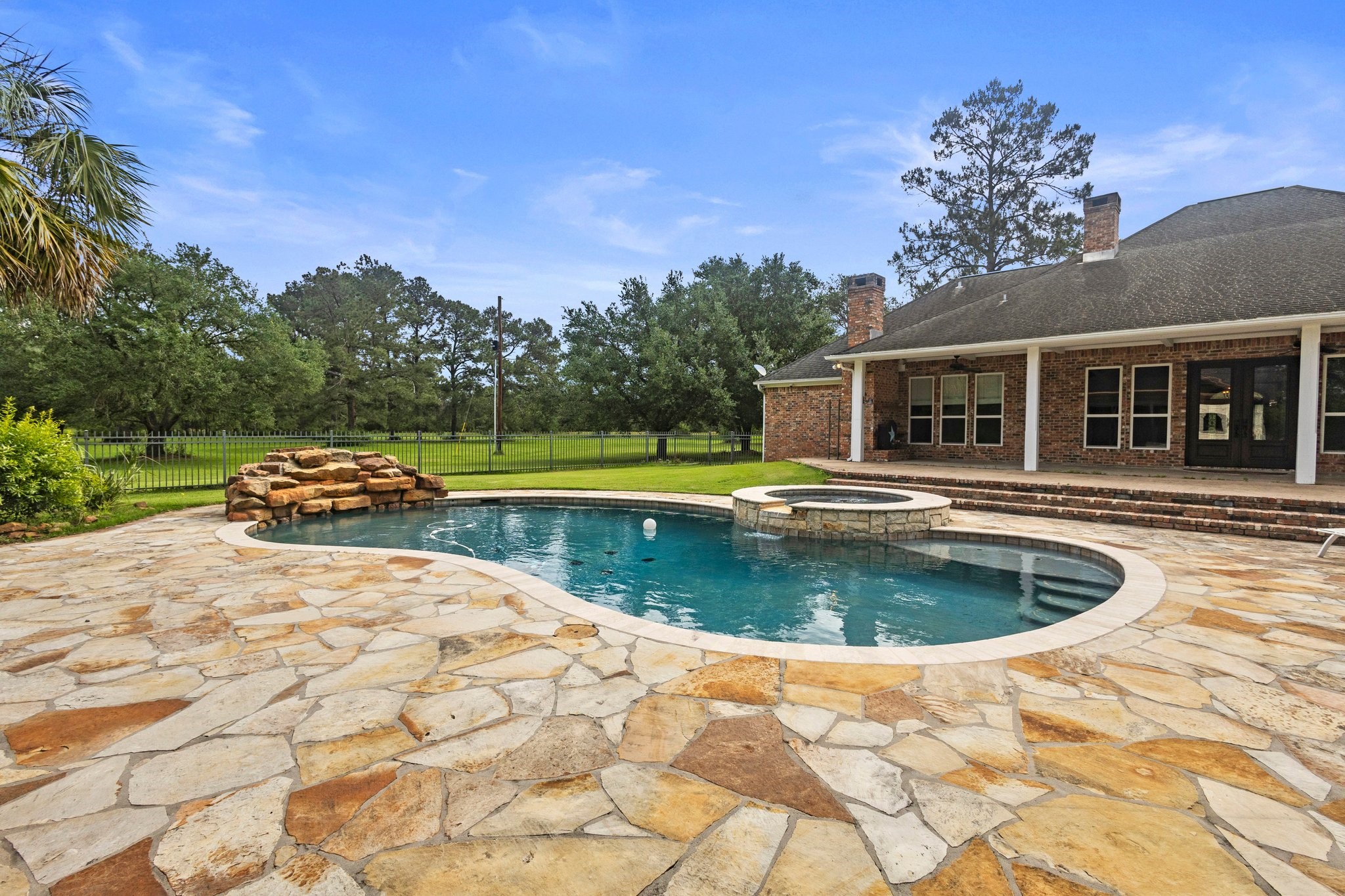 27076 Interstate 10 Winnie, TX 77665 - Photo 35 of 42 a swimming pool with outdoor seating and yard