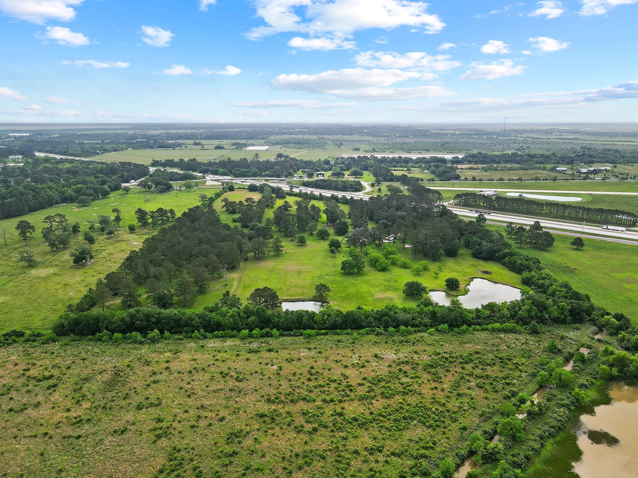 27076 Interstate 10 Winnie, TX 77665 - Photo 39 of 42 a view of a lake with a yard