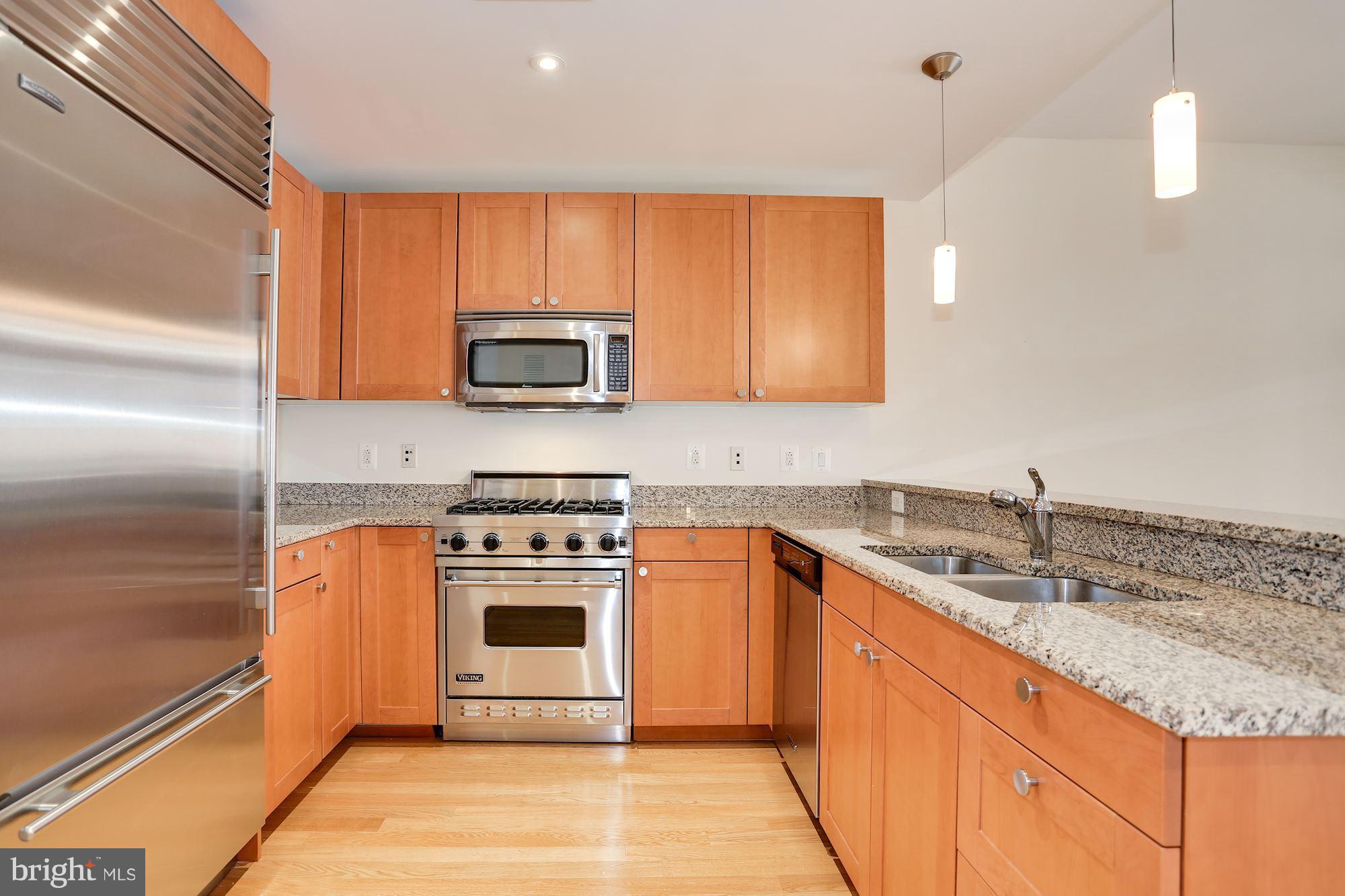 2425 L Street Northwest, Unit 533 Washington, DC 20037 - Photo 4 of 28 Chef's kitchen w/light granite counter tops