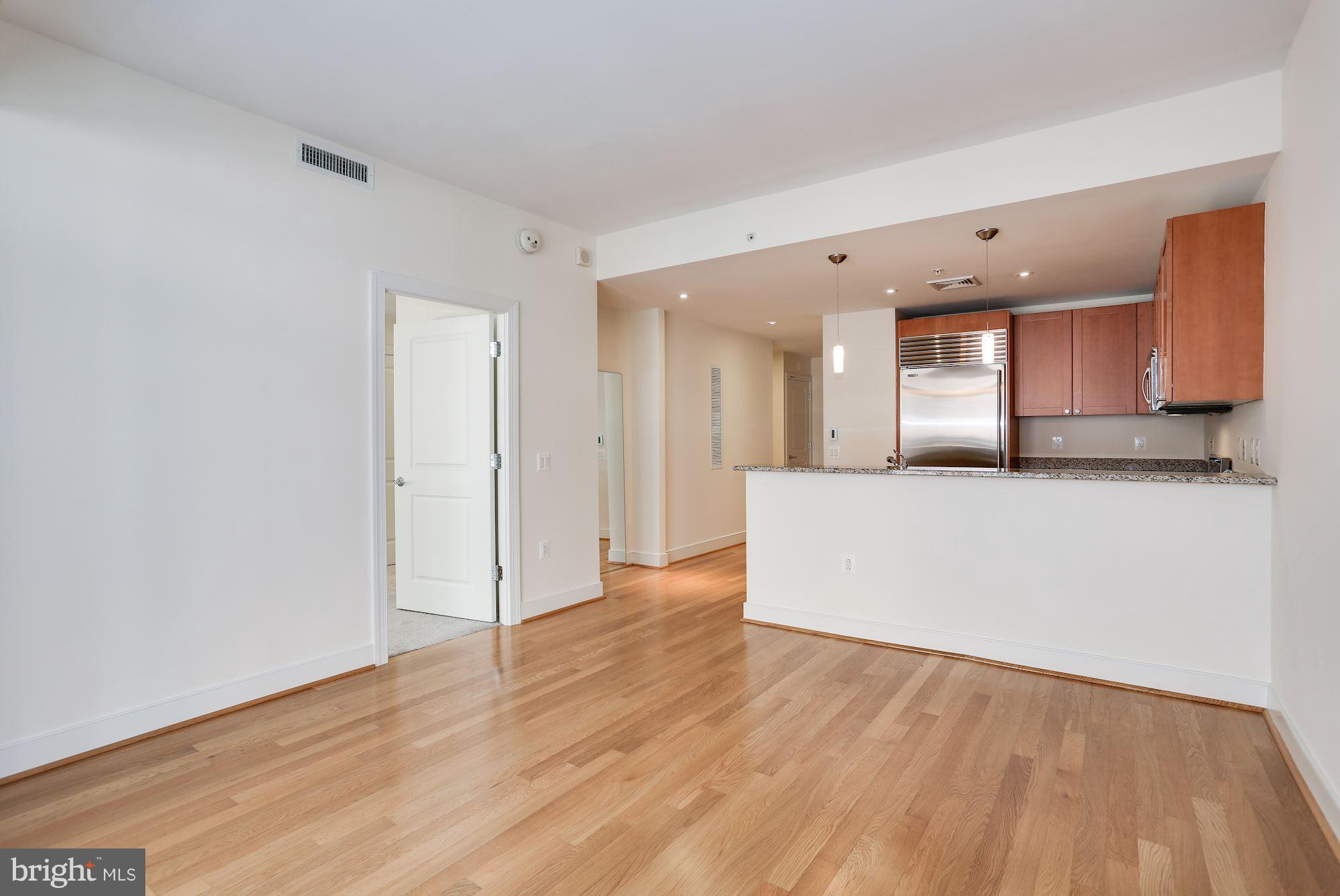 2425 L Street Northwest, Unit 533 Washington, DC 20037 - Photo 8 of 28 Breakfast bar comfortably seats 4