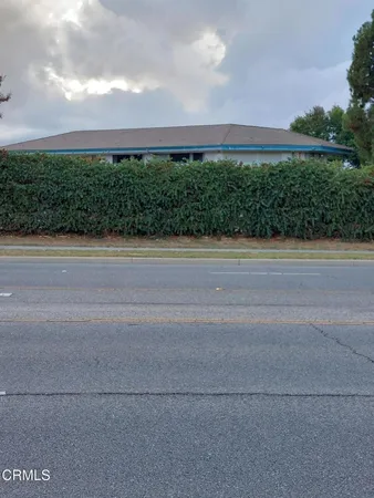 front view of a house with a street