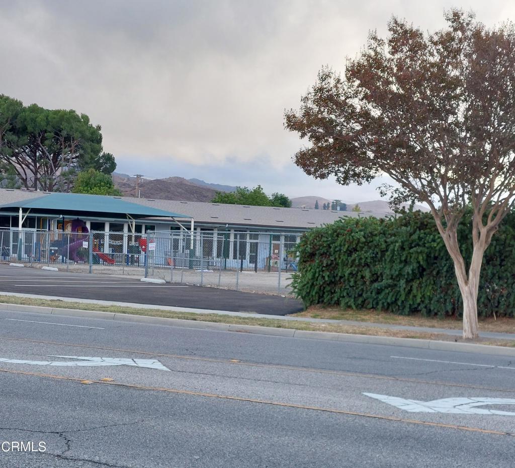 2025 Royal Avenue Simi Valley, CA 93065 - Photo 9 of 13 a front view of house with yard and green space