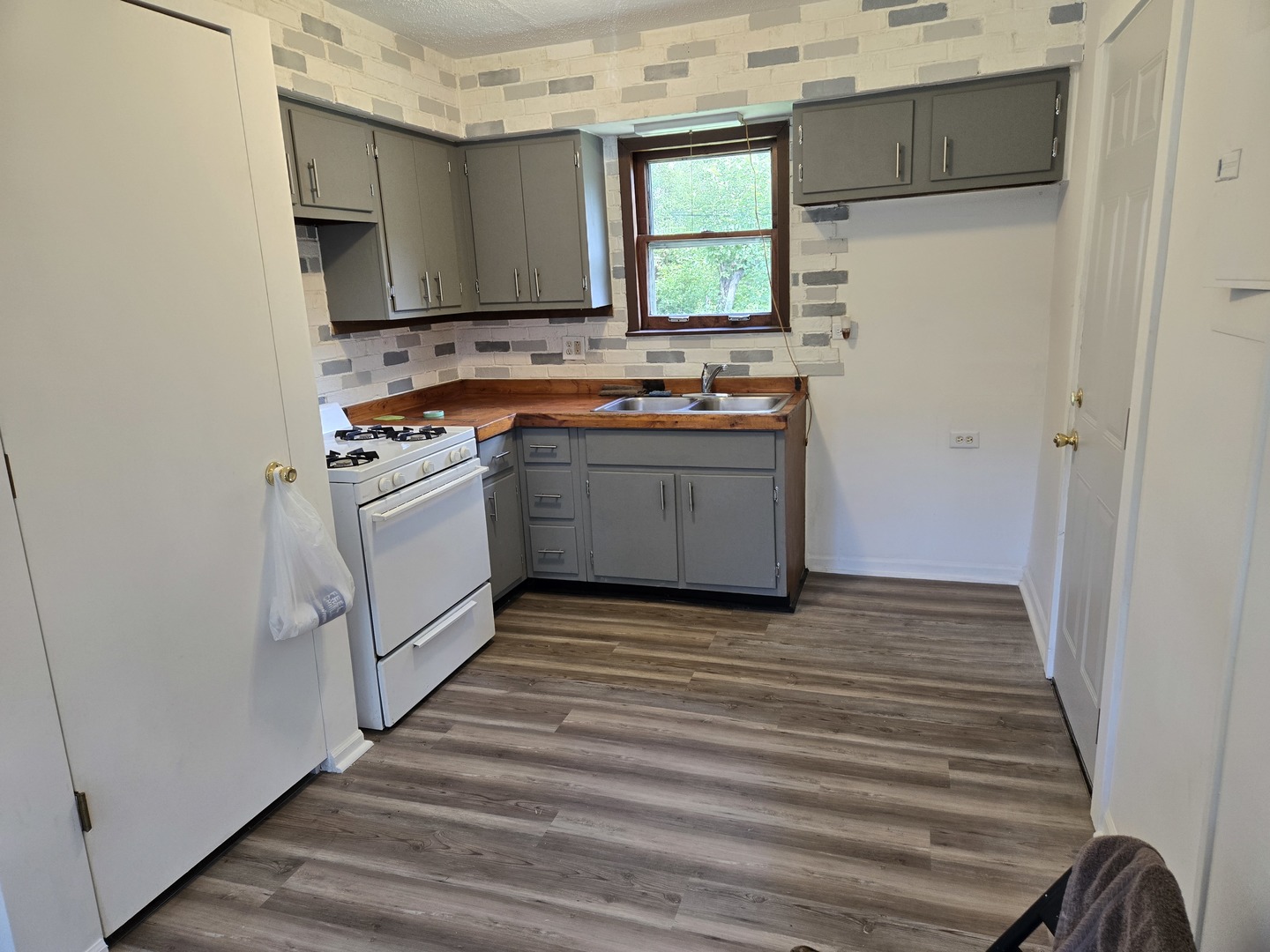 26895 Bernice Street Wauconda, IL 60084 - Photo 5 of 16 a view of kitchen with stainless steel appliances granite countertop a stove and a refrigerator