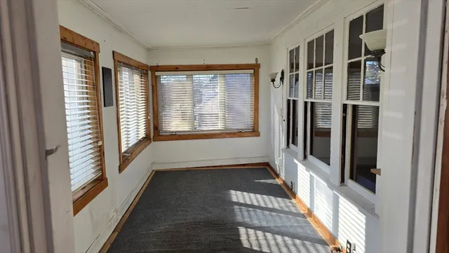 a view of a hallway with windows