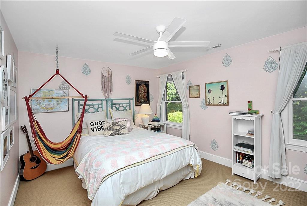 7319 St Clair Drive Charlotte, NC 28270 - Photo 15 of 39 a bedroom with a bed a mirror and a window