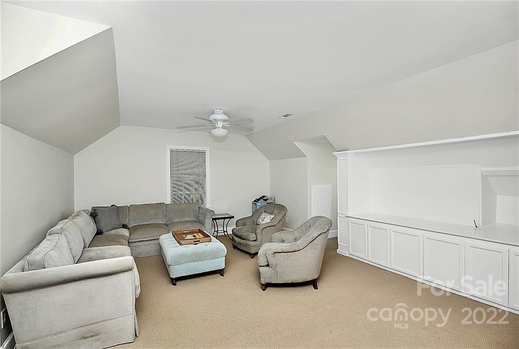 7319 St Clair Drive Charlotte, NC 28270 - Photo 27 of 39 a living room with furniture and a ceiling fan