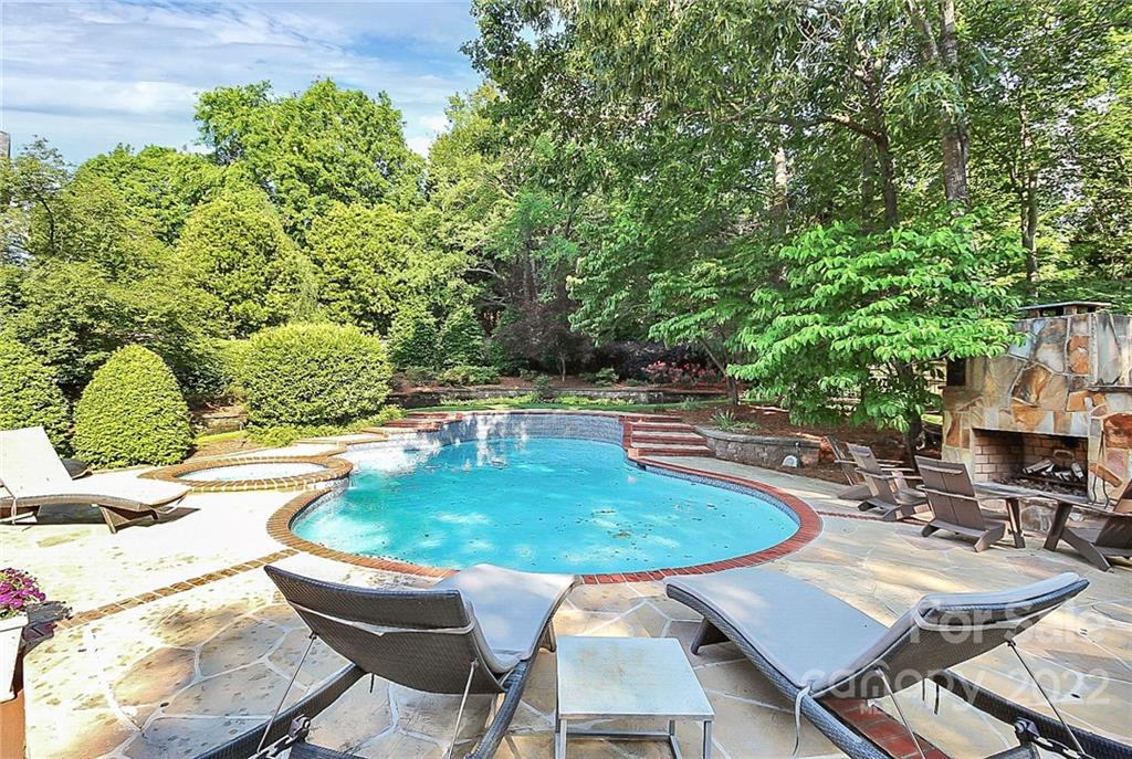 7319 St Clair Drive Charlotte, NC 28270 - Photo 33 of 39 a table and chairs in a patio