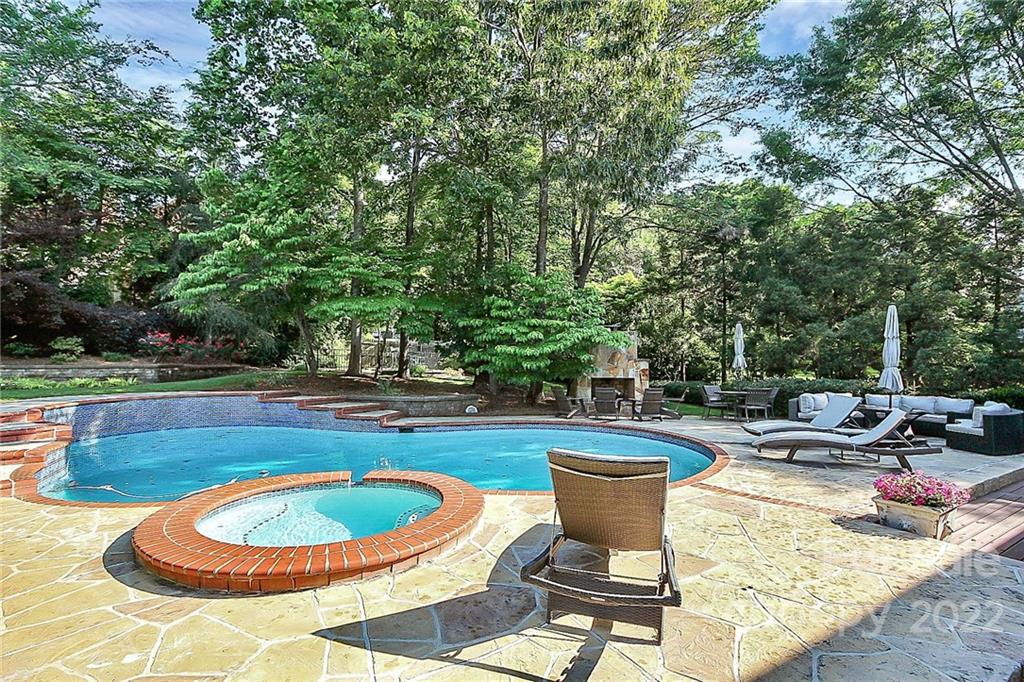 7319 St Clair Drive Charlotte, NC 28270 - Photo 36 of 39 a view of a swimming pool and lounge chair