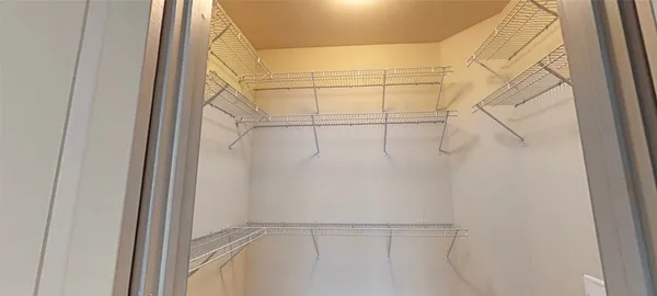 a view of a room with racks on the wall