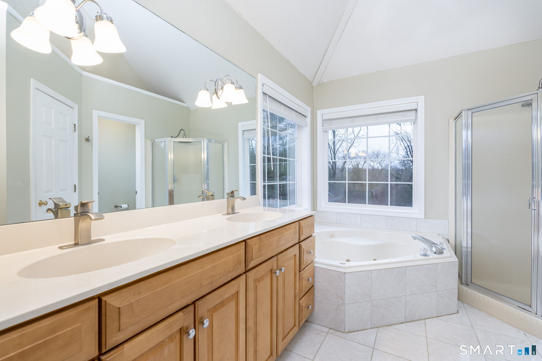 559 West Main Street Hebron, CT 06231 - Photo 11 of 29 a bathroom with a tub sink and mirror