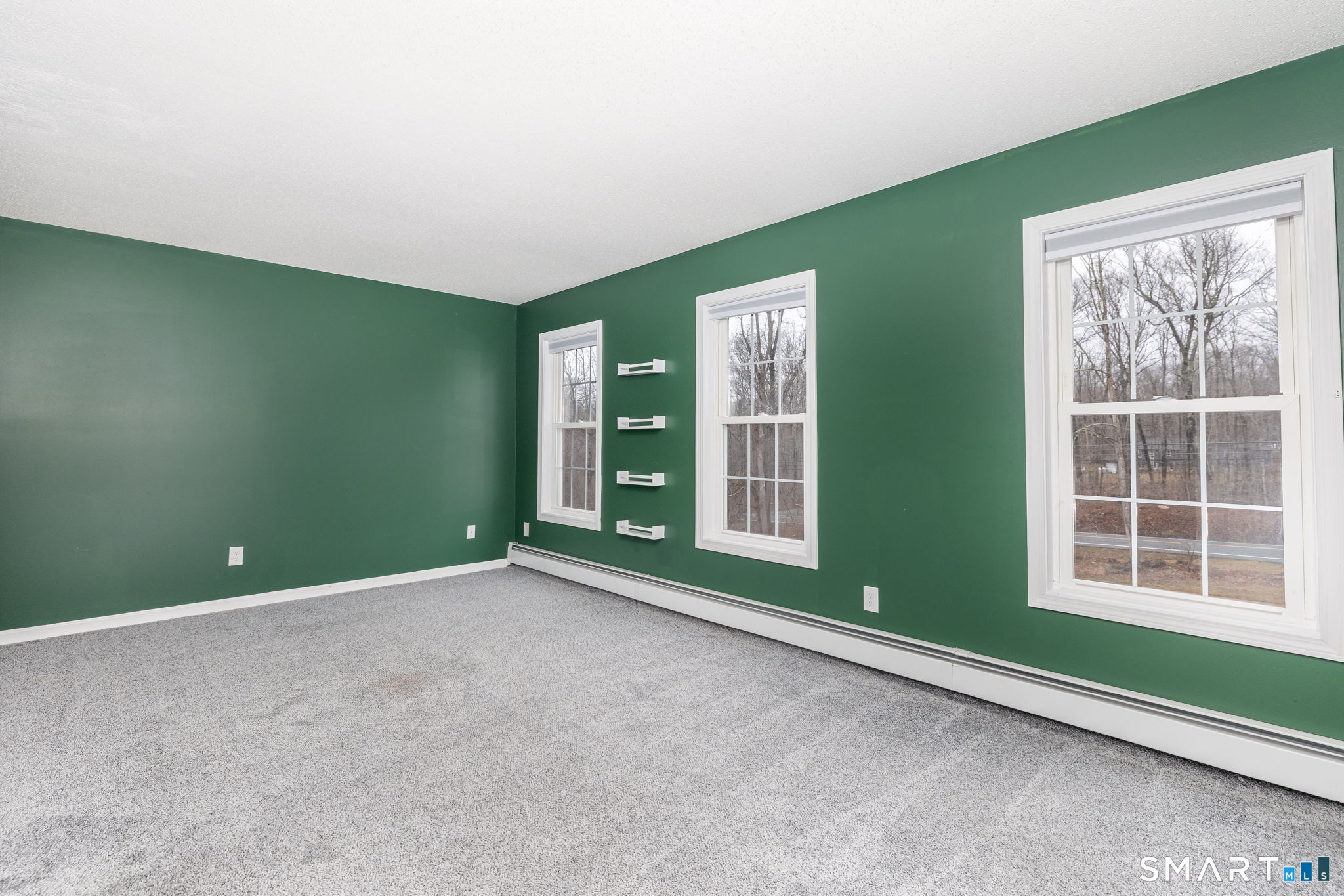 559 West Main Street Hebron, CT 06231 - Photo 18 of 29 an empty room with a window