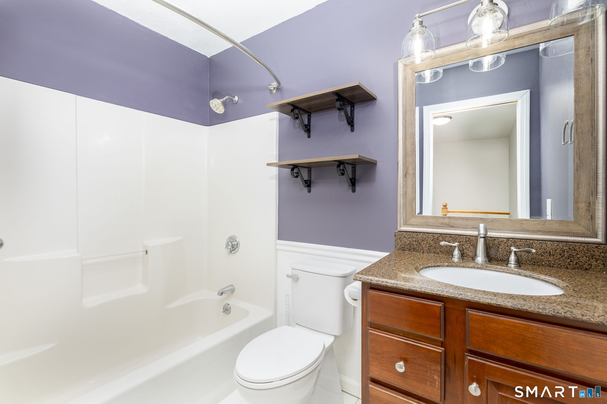 559 West Main Street Hebron, CT 06231 - Photo 19 of 29 a bathroom with a granite countertop sink toilet and shower