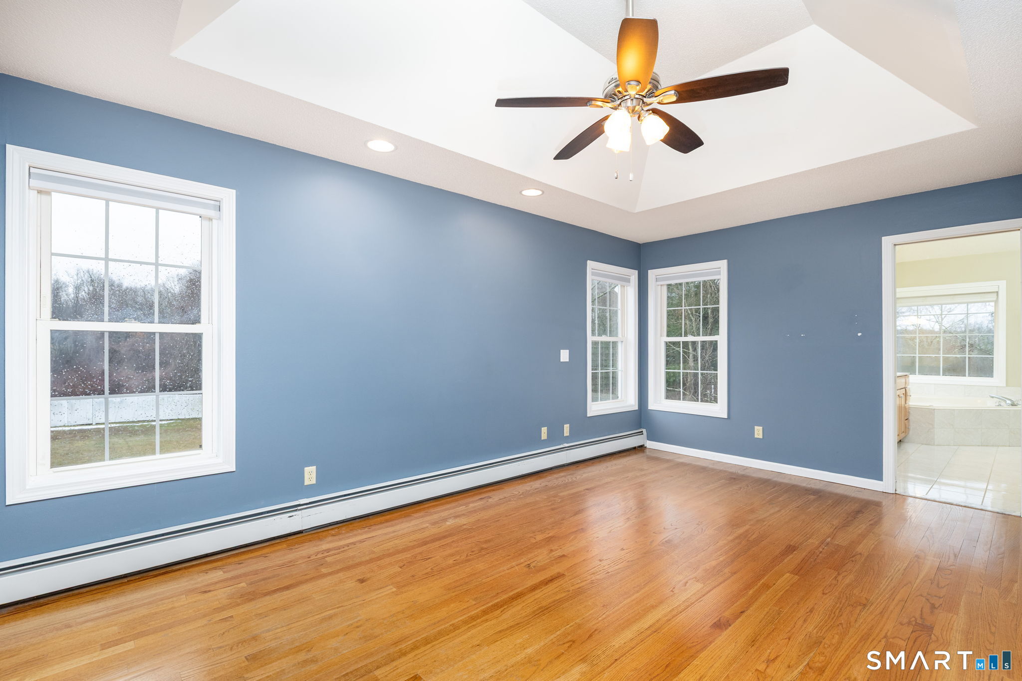 559 West Main Street Hebron, CT 06231 - Photo 21 of 29 a view of an empty room with window and wooden floor
