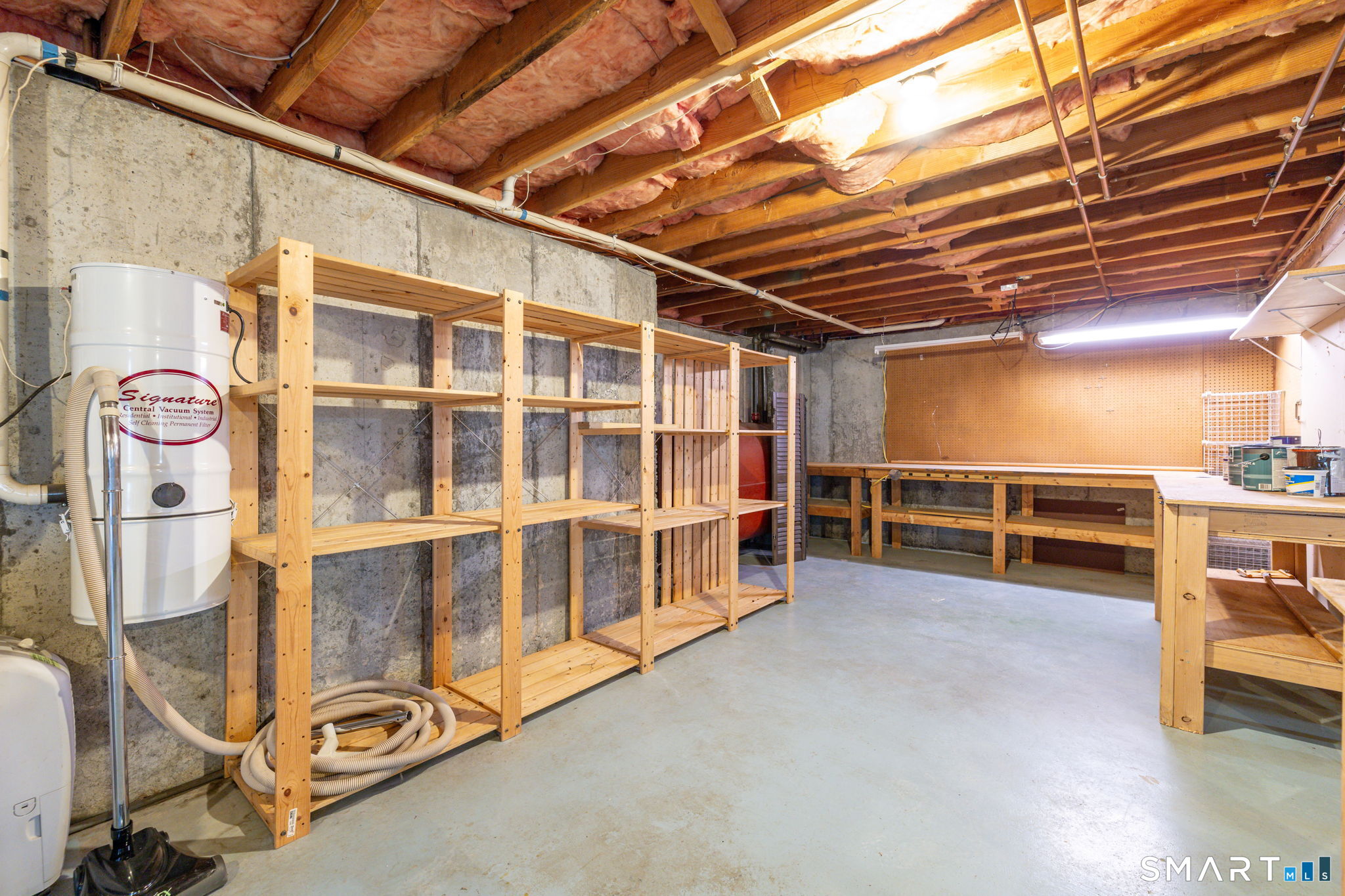 559 West Main Street Hebron, CT 06231 - Photo 24 of 29 a view of an empty room with wooden floor and windows