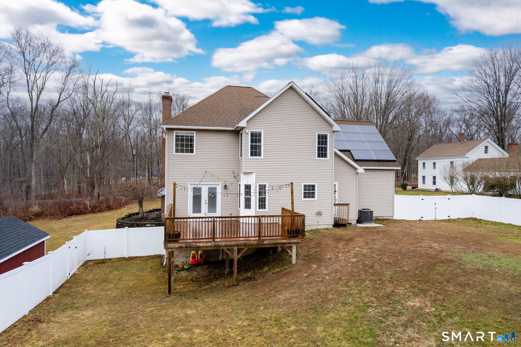 559 West Main Street Hebron, CT 06231 - Photo 26 of 29 a backyard of a house with table and chairs