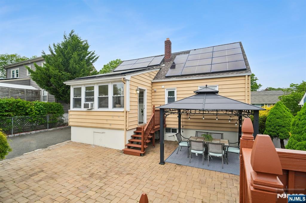 26 Rutgers Place Bloomfield, NJ 07003 - Photo 29 of 38 a view of a house with a chairs and table in a patio