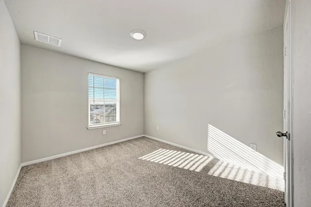 a bathroom with a glass shower door and a bathtub