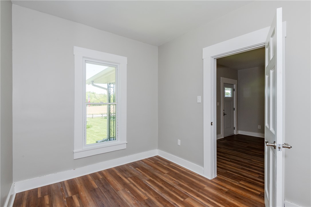 1217 Jasper Road Xenia, OH 45385 - Photo 31 of 62 This bright room features a window overlooking lush greenery, offering a serene and inviting atmosphere.