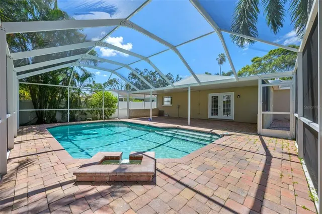 a view of backyard with plants and outdoor seating