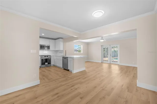 a view of kitchen with wooden floor