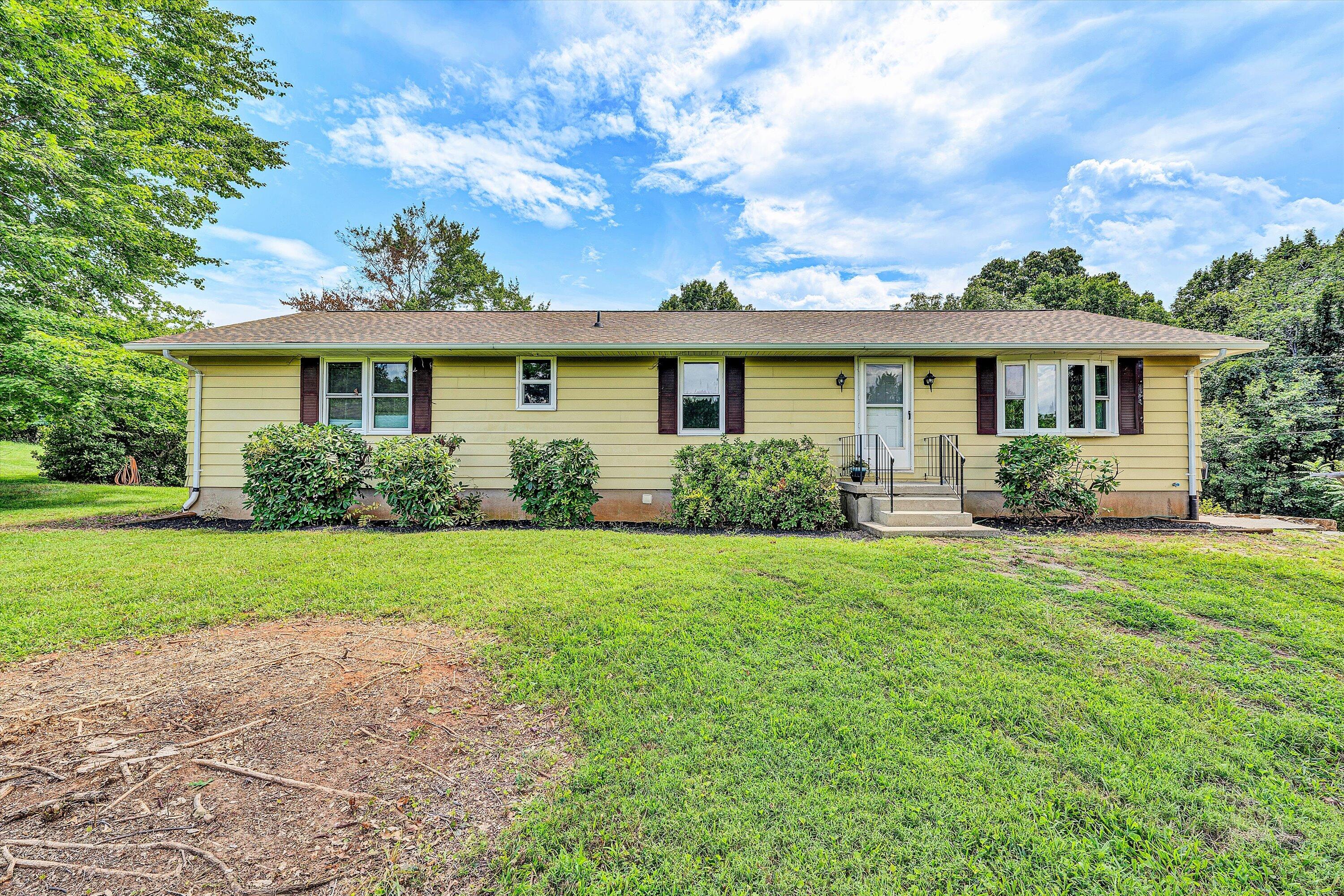 7089 Goodview Road, Unit 7087 Goodview, VA 24095 - Photo 1 of 70 a front view of house with yard and green space