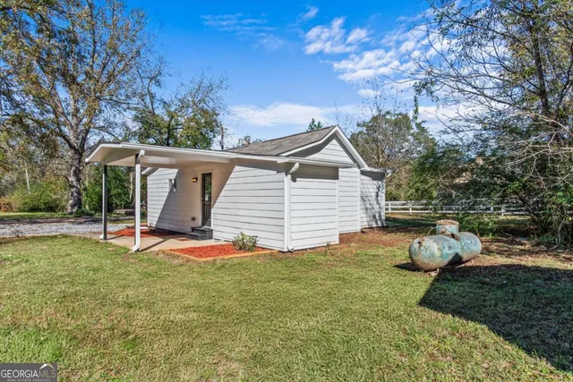 a house with trees in the background