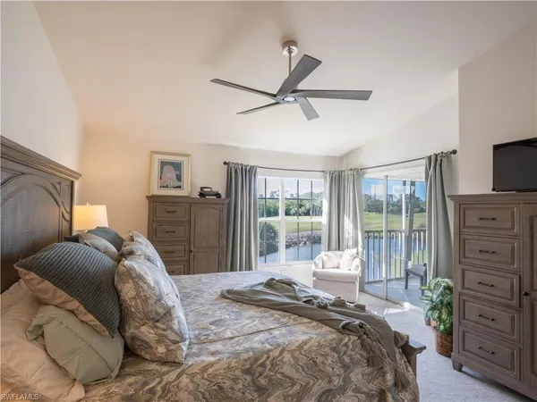a bedroom with a bed dresser and a window