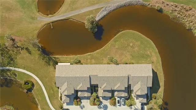 an aerial view of a house with a swimming pool