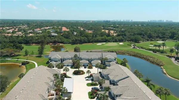 an aerial view of a house with a lake view
