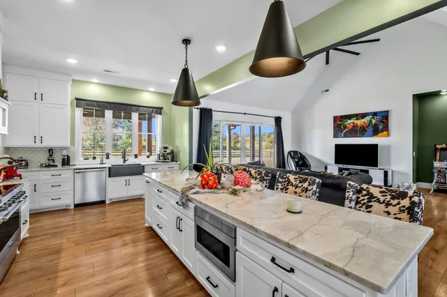 a view of walk in closet with clothes