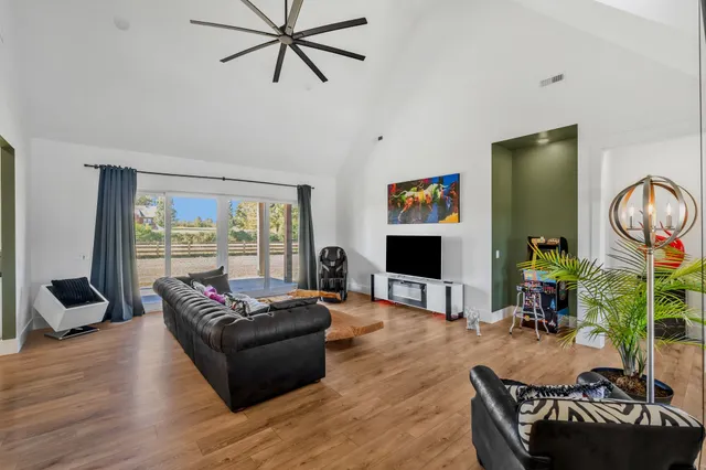 a bathroom with a double vanity sink a large mirror and shower