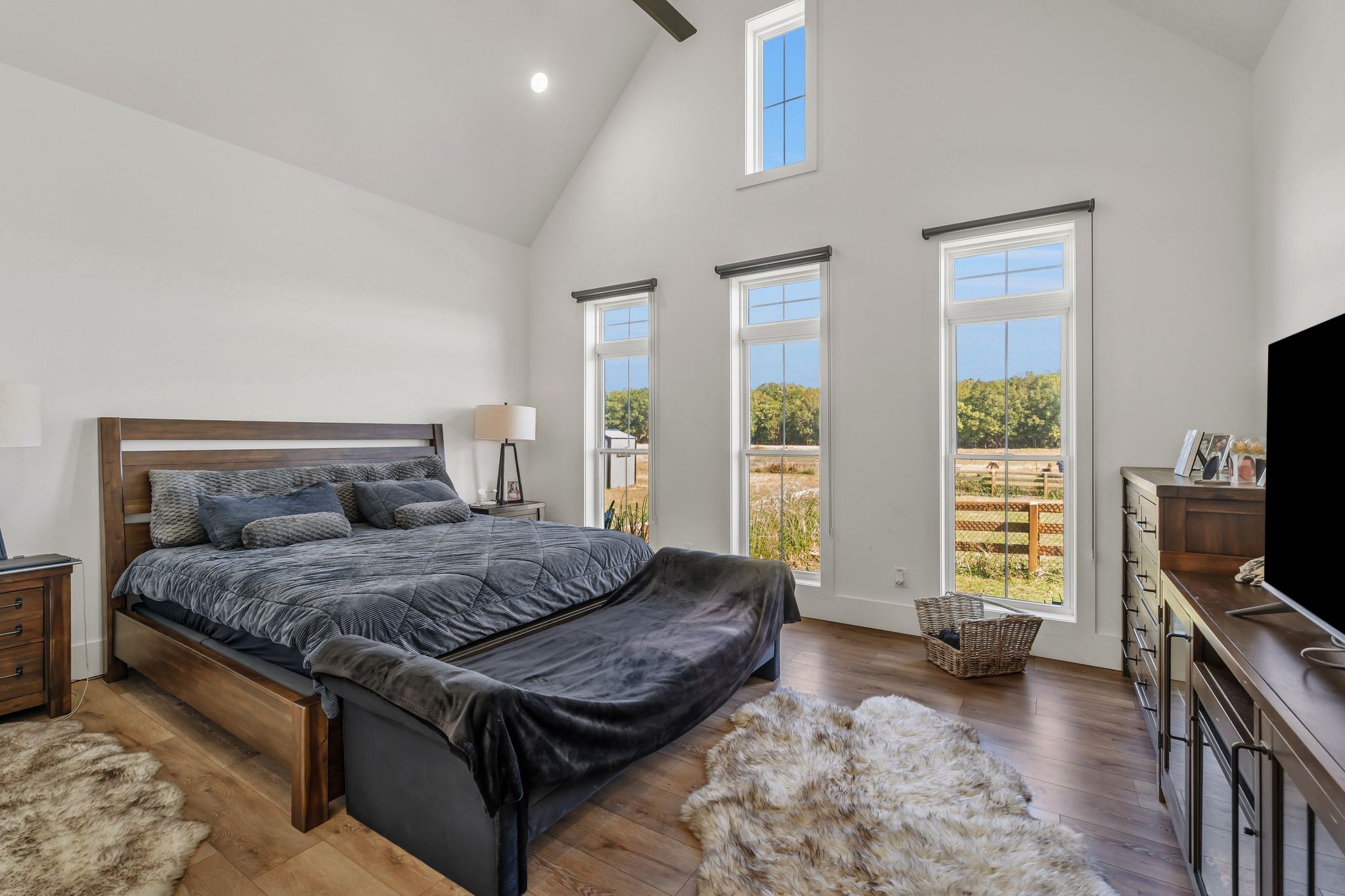 128 Emma Street Hohenwald, TN 38462 - Photo 27 of 96 a living room with a bed furniture and a flat screen tv