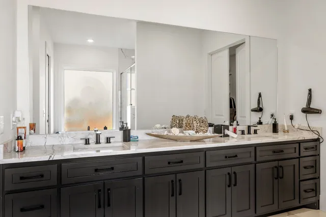 a view of a house with backyard porch and sitting area