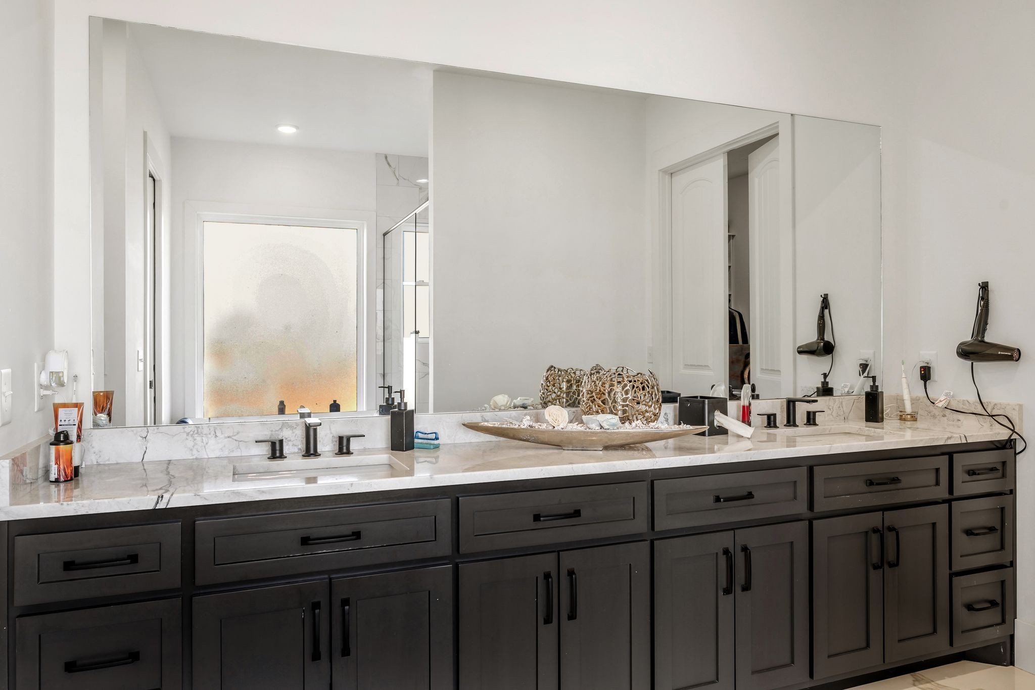 128 Emma Street Hohenwald, TN 38462 - Photo 30 of 96 a bathroom with double sink and a mirror