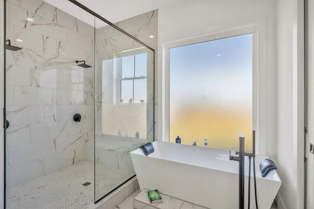 a view of a house with a big yard and large trees