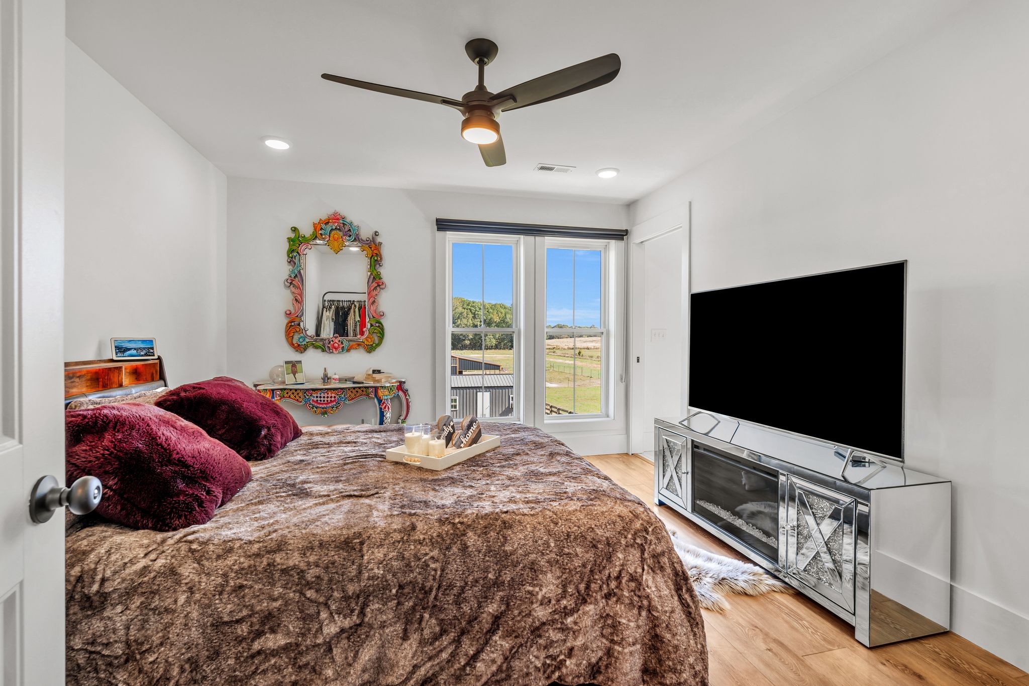 128 Emma Street Hohenwald, TN 38462 - Photo 40 of 96 a bedroom with a bed and a flat screen tv