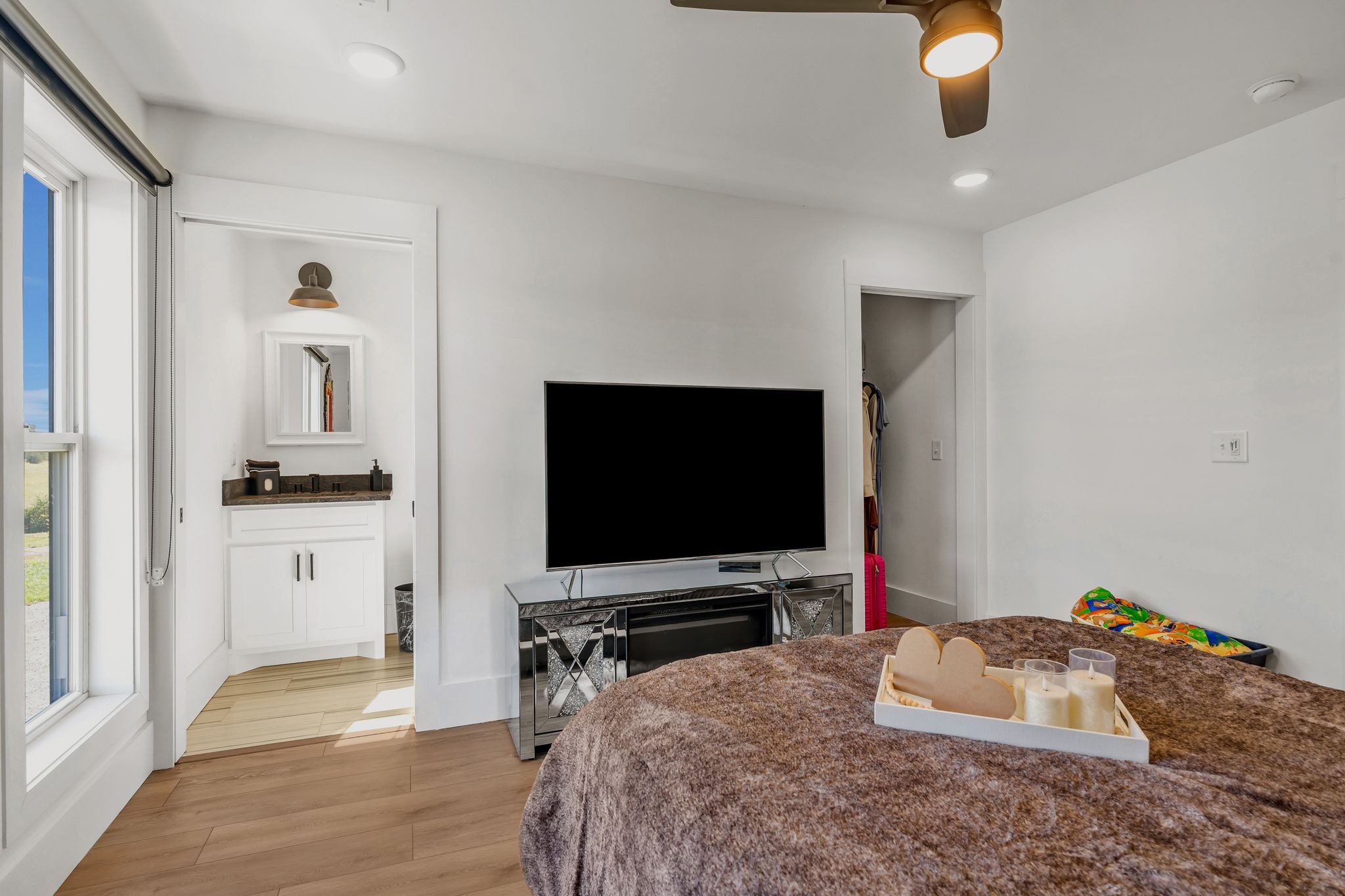 128 Emma Street Hohenwald, TN 38462 - Photo 41 of 96 a bedroom with a bed and a flat screen tv