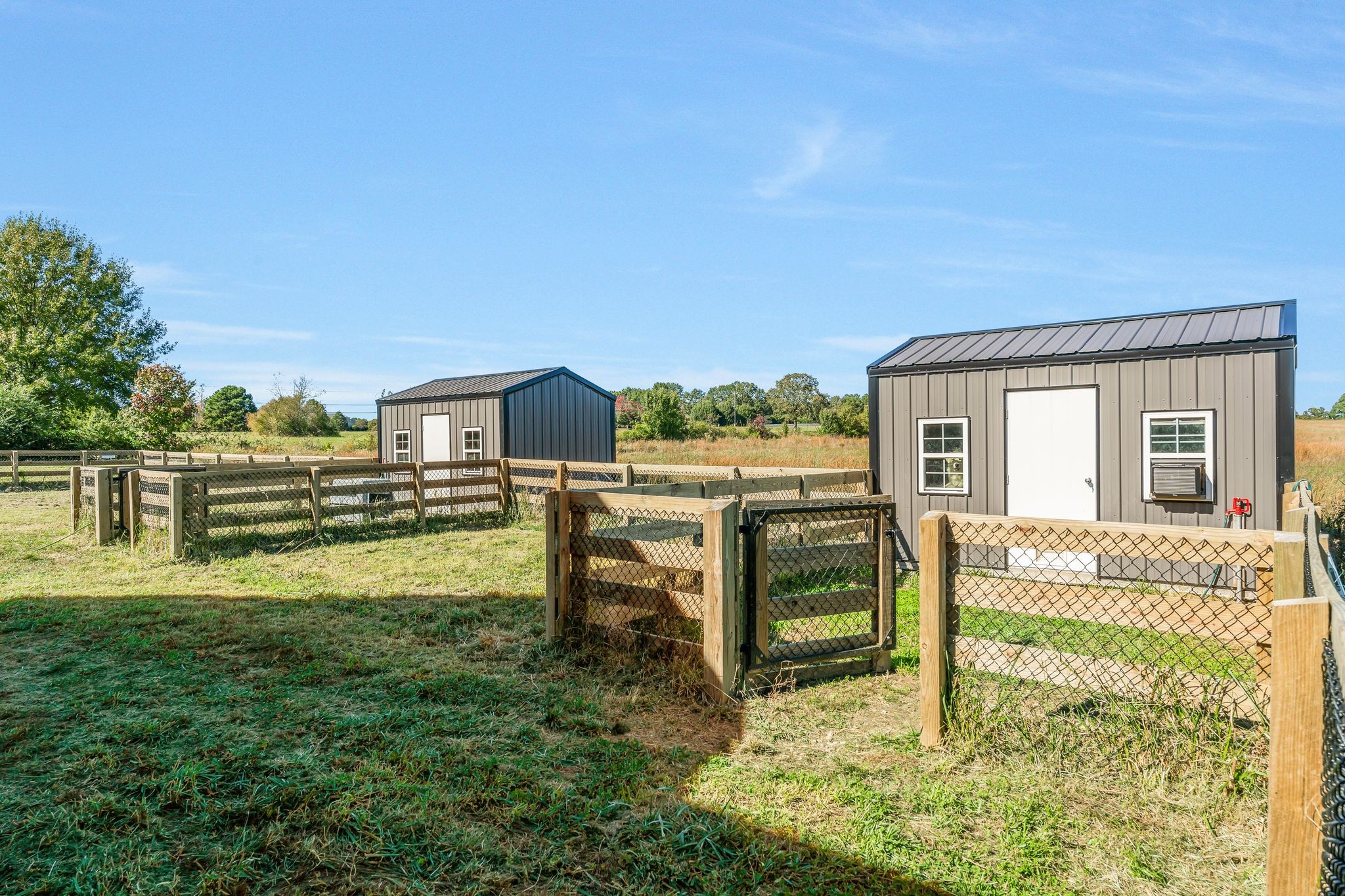 128 Emma Street Hohenwald, TN 38462 - Photo 50 of 96 a view of a house with backyard porch and sitting area
