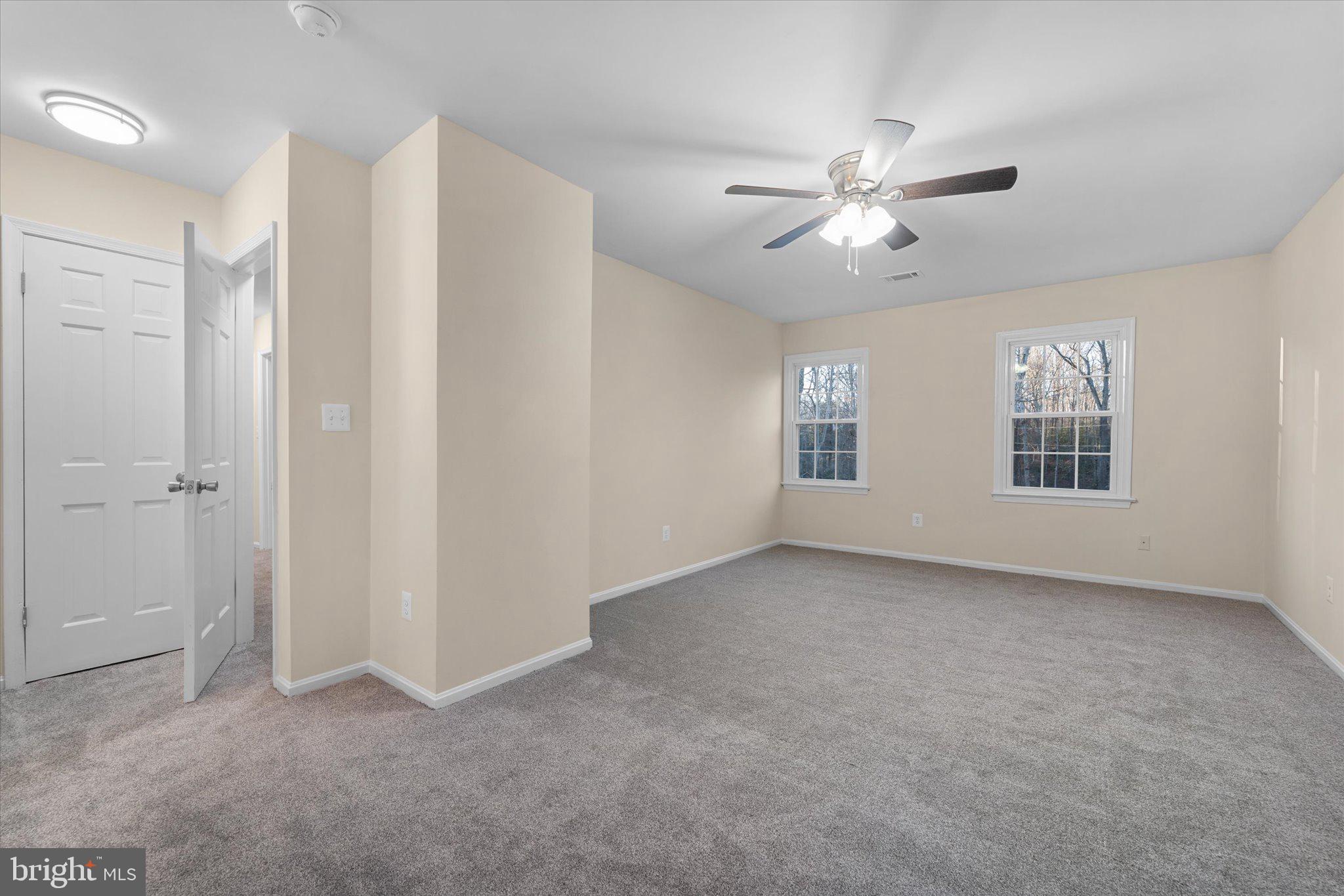 8016 Stillbrooke Road Manassas, VA 20112 - Photo 20 of 41 a view of an empty room with a window