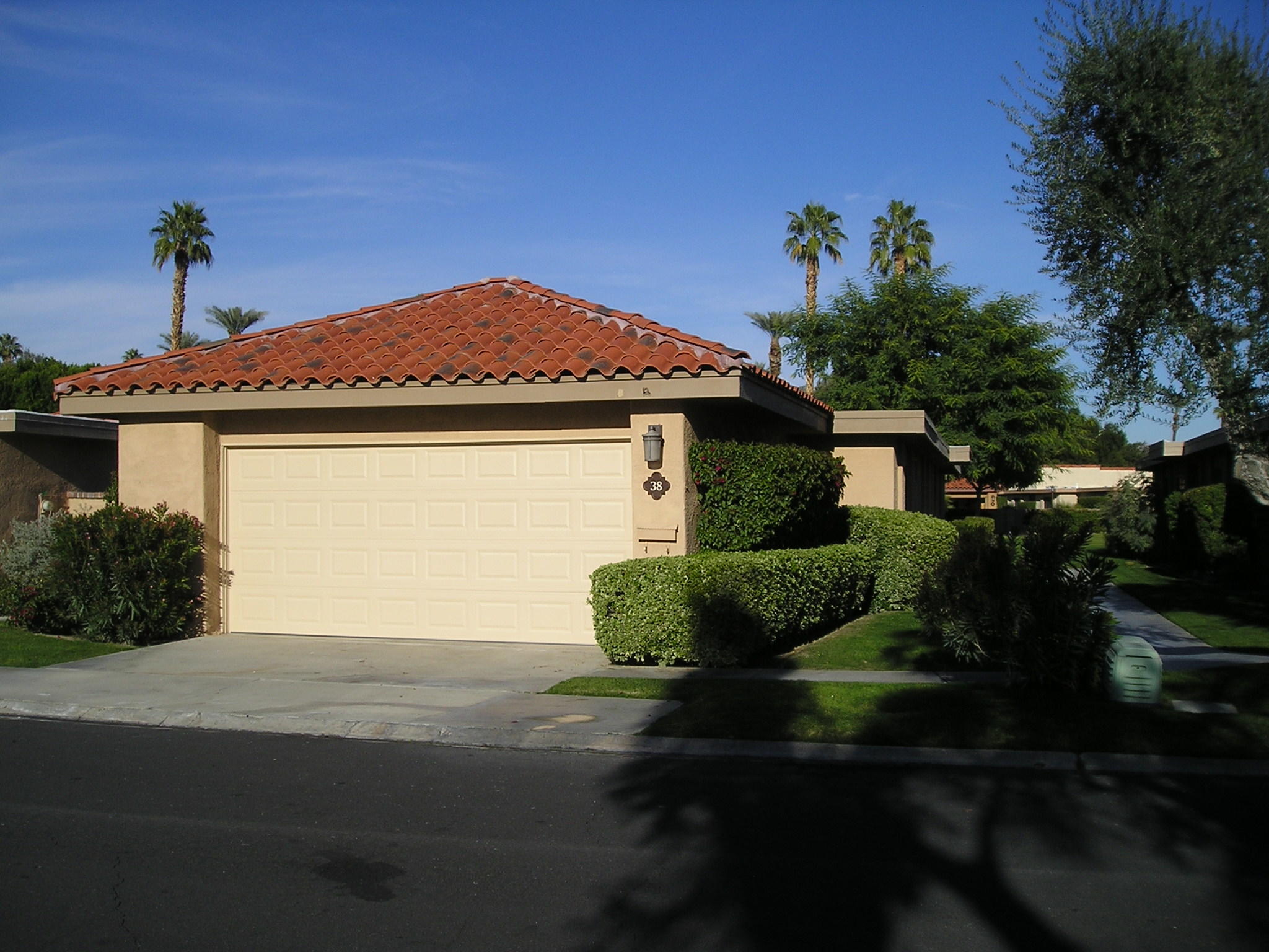 38 Malaga Drive Rancho Mirage, CA 92270 - Photo 3 of 37 a front view of a house with garden
