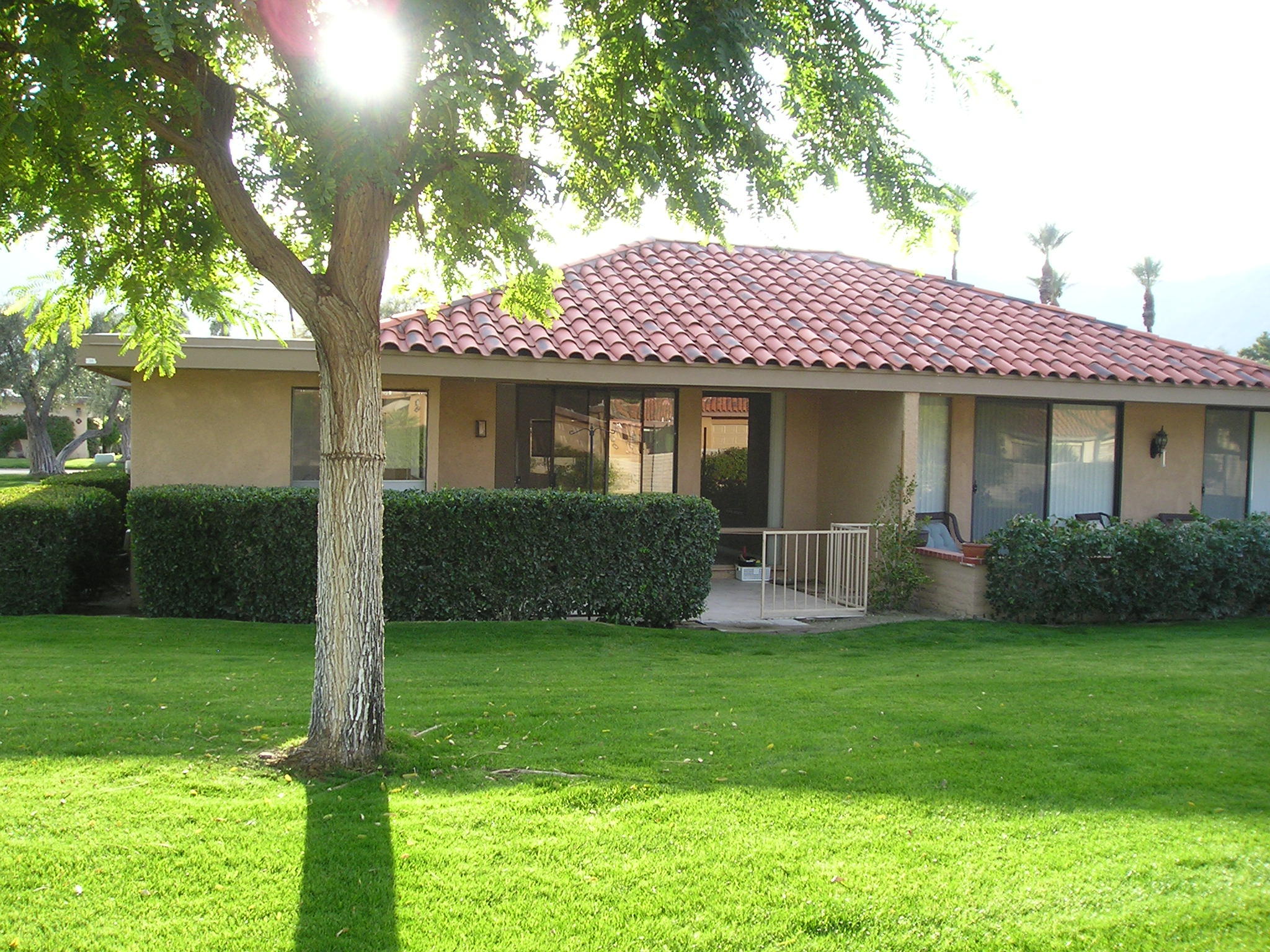 38 Malaga Drive Rancho Mirage, CA 92270 - Photo 35 of 37 a front view of a house with a yard and trees